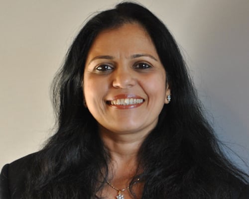 team1 A woman with long black hair smiling for the camera.